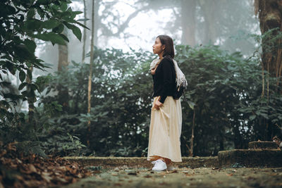 Young woman looking at forest