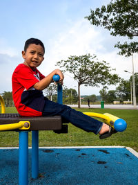 Portrait of boy playing at park