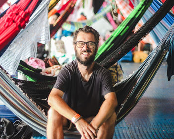 Portrait of young man sitting in boat