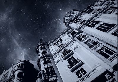 Low angle view of illuminated building against sky