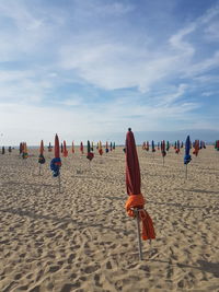 People on beach against sky