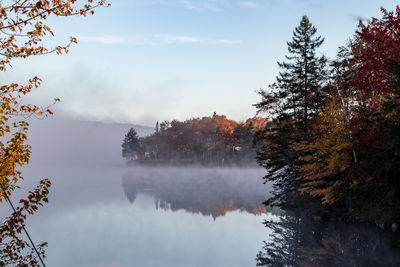 Scenic view of lake against sky during autumn