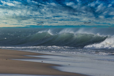 Scenic view of waves rushing towards shore