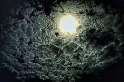 Low angle view of illuminated building against sky at night
