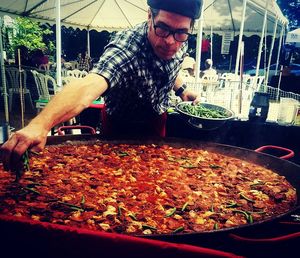 Midsection of man preparing food