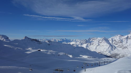 Scenic view of mountains against sky during winter