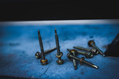 Close-up of rusty metal on table