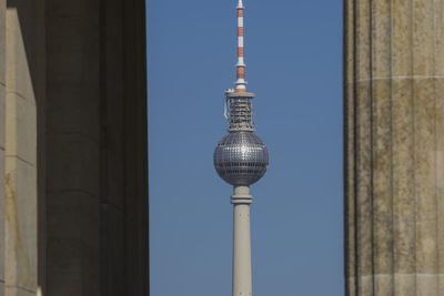 Low angle view of tower against clear blue sky