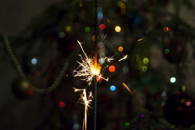 Close-up of sparkler at night