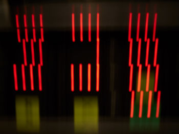 Close-up of illuminated lights against black background