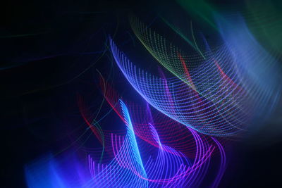 Close-up of light painting against black background