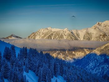 Scenic view of mountains against sky during winter