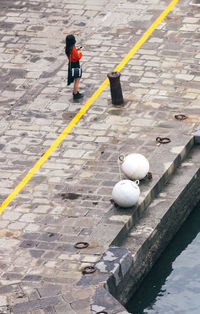 High angle view of man walking on street