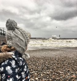 Man on beach against sky