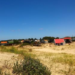 Panoramic view of built structures against clear sky