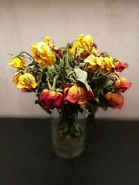 Close-up of yellow roses in vase
