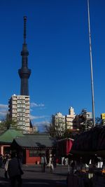 City lit up against clear blue sky