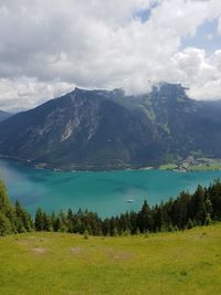 Scenic view of landscape and mountains against sky