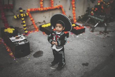 Portrait of cute boy standing outdoors