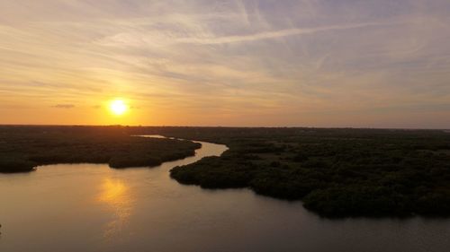Scenic view of calm sea at sunset