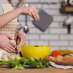 Cropped hands of man preparing food