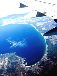 Aerial view of airplane wing over landscape