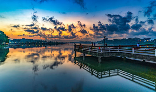 Scenic view of lake against sky during sunset