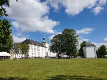 View of trees and buildings against sky