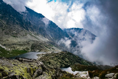 Scenic view of mountains in foggy weather