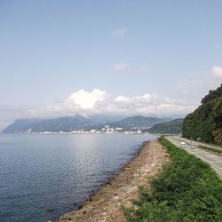 Scenic view of sea against cloudy sky