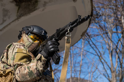 Low angle view of man standing against sky