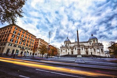 Blurred motion of road against cloudy sky