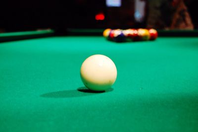 Close-up of cue ball on pool table