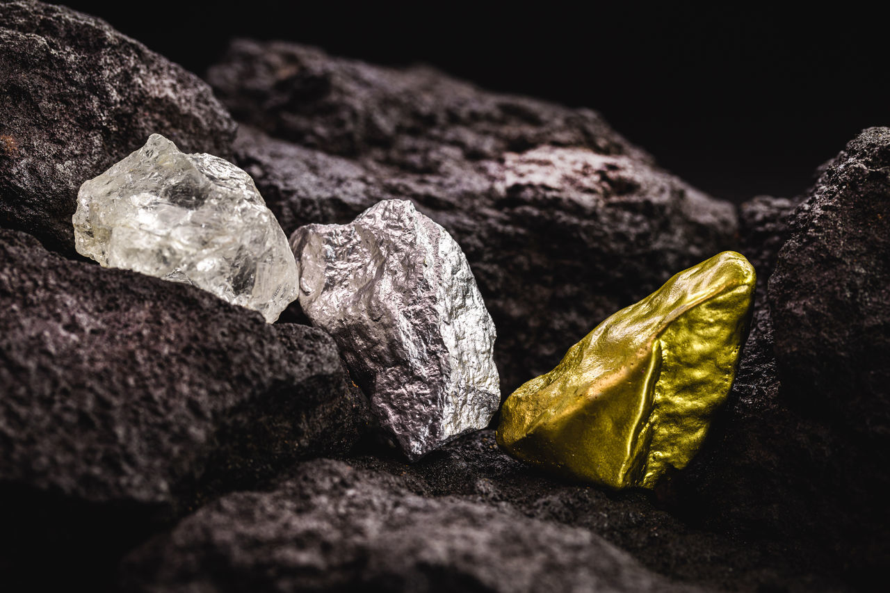 CLOSE-UP OF ROCKS ON ROCK AGAINST WALL