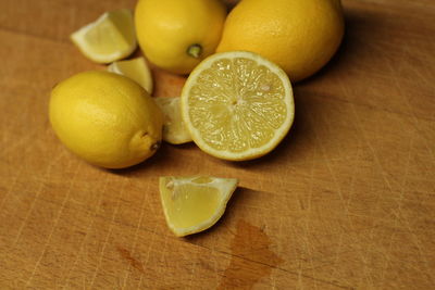 High angle view of lemons on cutting board