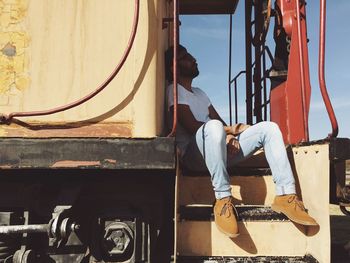 Low section of man sitting on boat