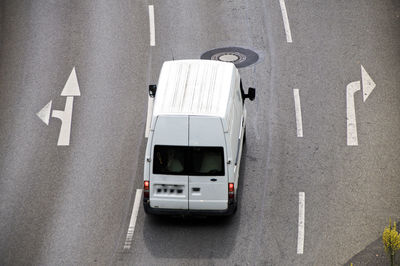 High angle view of van by road sign on street