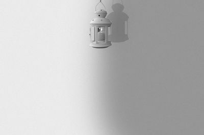 Close-up of lamp over white background