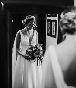 Reflection of bride in mirror