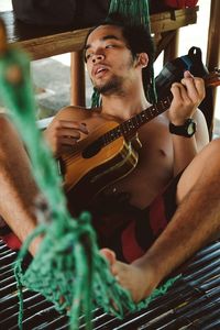 Young woman playing guitar