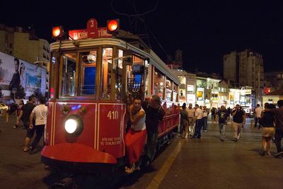 Illuminated christmas lights in city at night