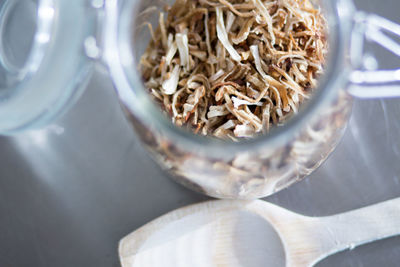 High angle view of dry mushrooms in jar on table