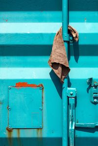 Dirty towel stuck to metal cabin