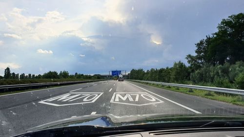 Road seen through car windshield