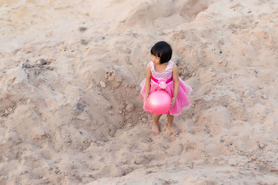 High angle view of girl standing on beach