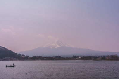 Scenic view of lake against cloudy sky