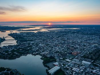 High angle view of city during sunset