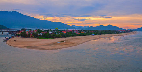 Scenic view of beach against sky during sunset