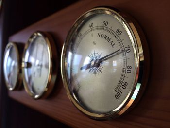 Close-up of clock on table