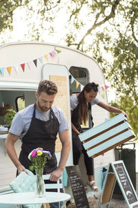 Owners working outside food truck on street